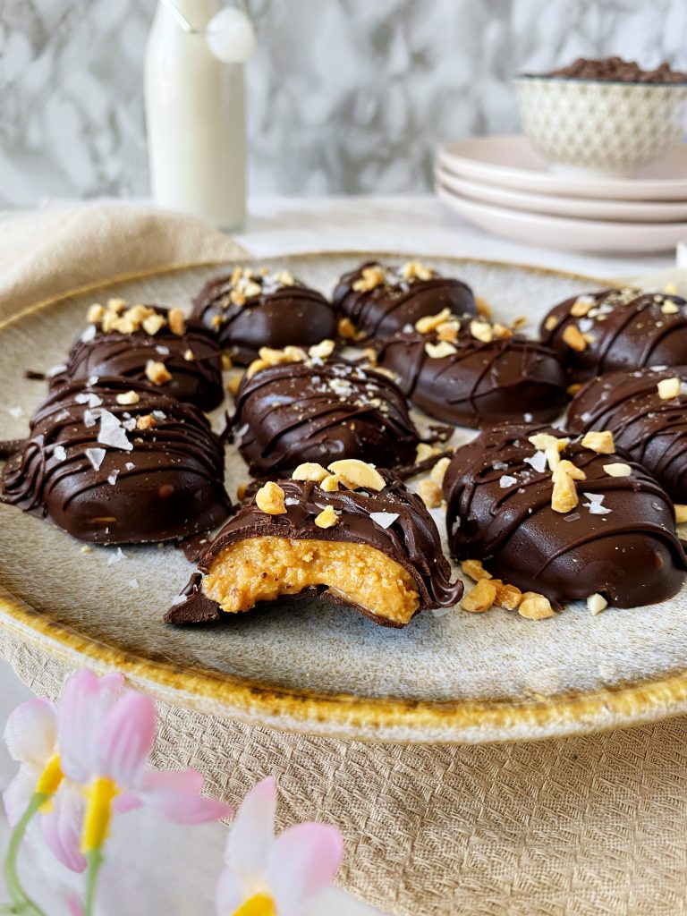 reese's eggs with a bite taken out of it in a plate 