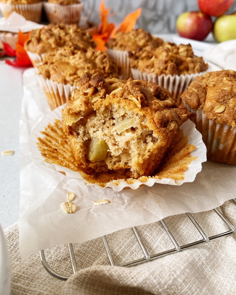 apple walnut muffin with a bite taken out of it