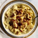 creamy vegan alfredo sauce with sun-dried tomatoes in a bowl