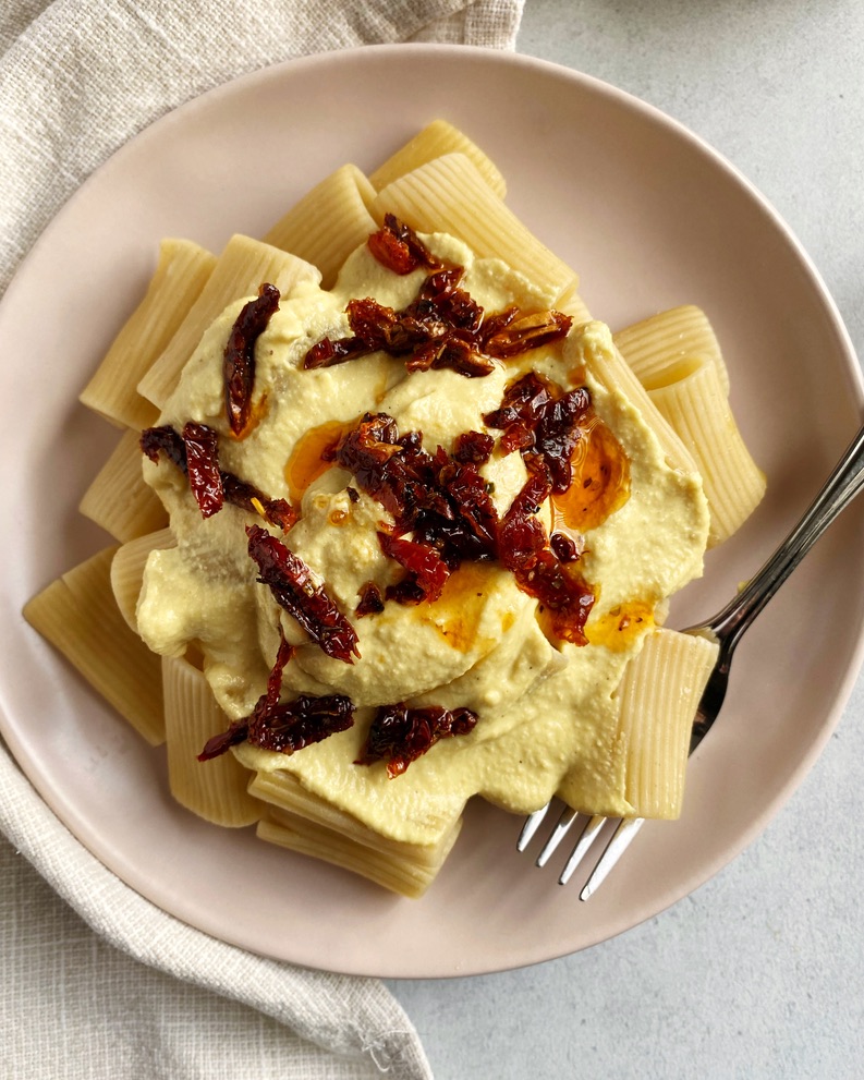 Rigatoni topped with Vegan Alfredo sauce with sun-dried tomatoes