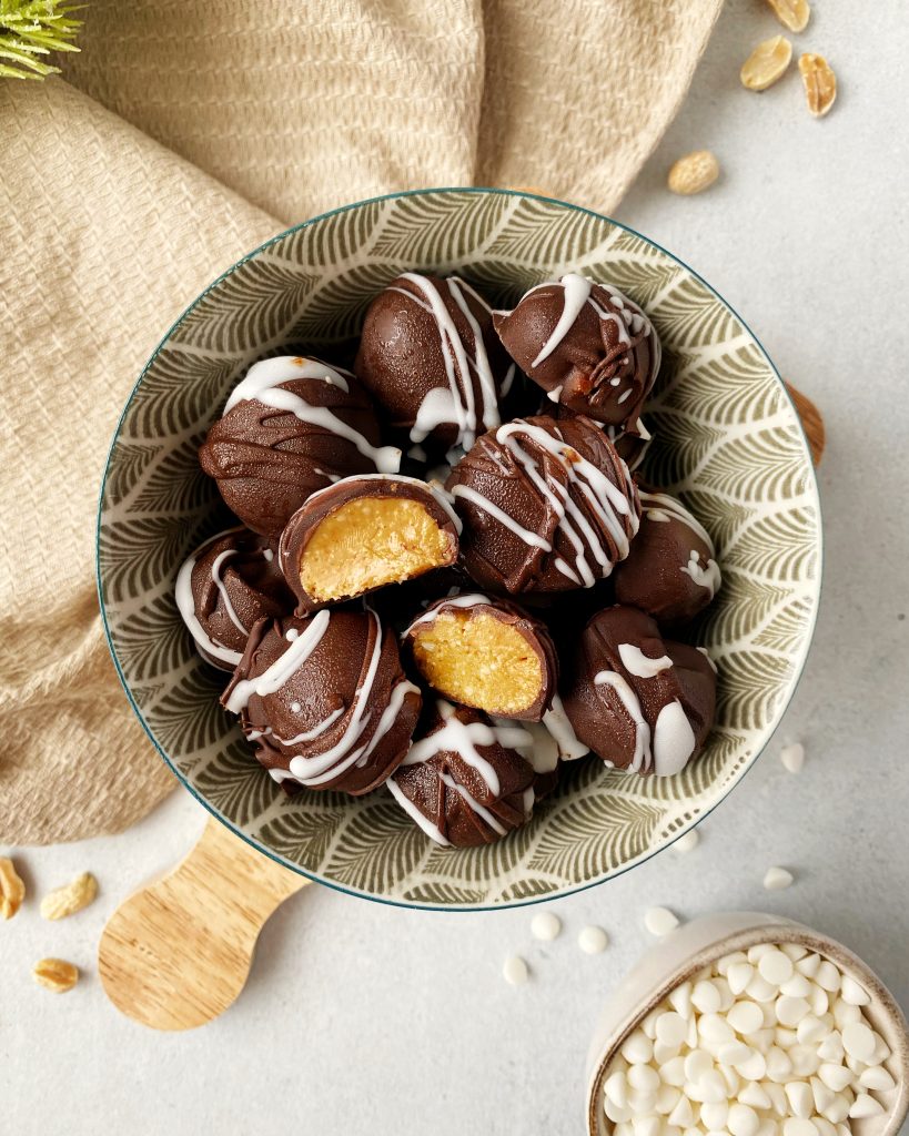 healthy no bake chocolate peanut butter truffles in a small bowl