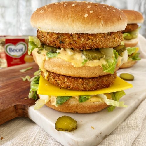 vegan double stacked chicken sandwich on cutting board
