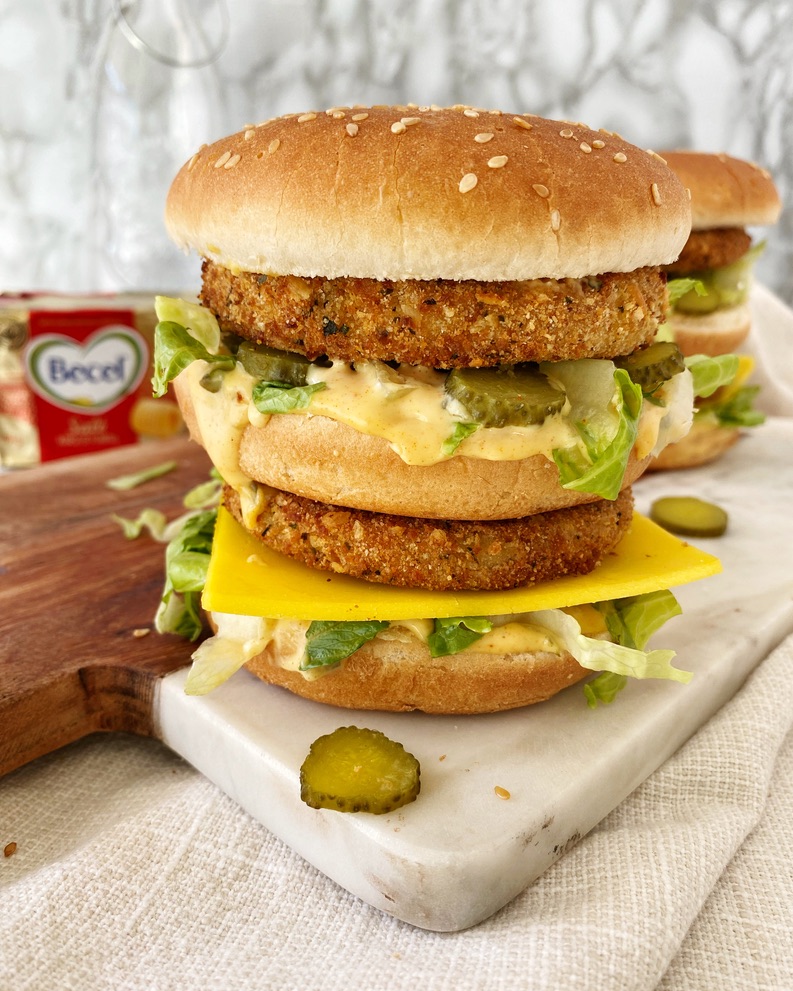 vegan double stacked chicken sandwich on cutting board