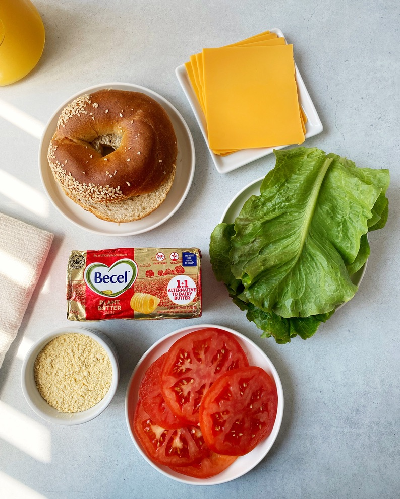 ingredients to make vegan breakfast bagel spread out on a counter