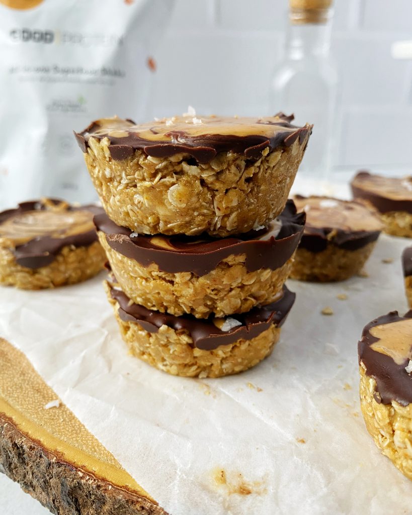 three salted caramel oat cups stacked on top of each other
