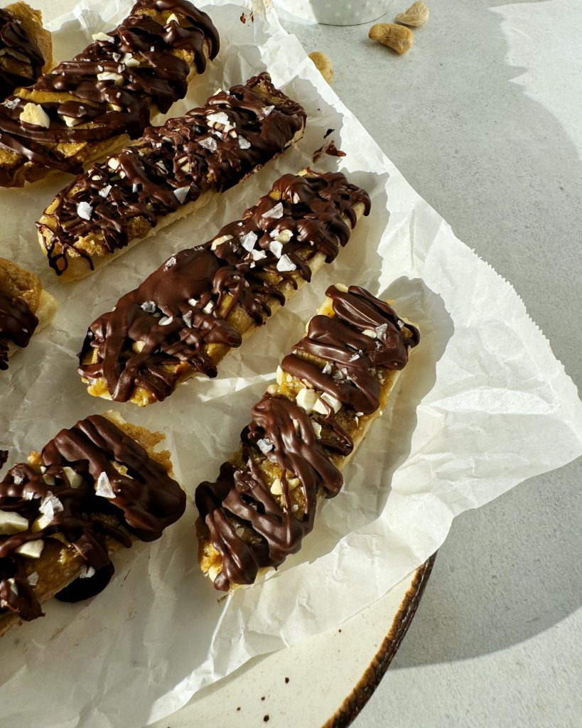 close up of banana snickers bite in oval plate