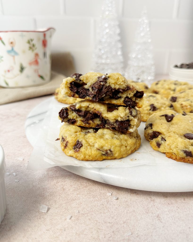 'nutella' stuffed chocolate chip cookies cut in half to show the center