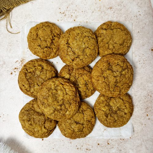 Vegan ginger molasses cookies placed on a parchment paper