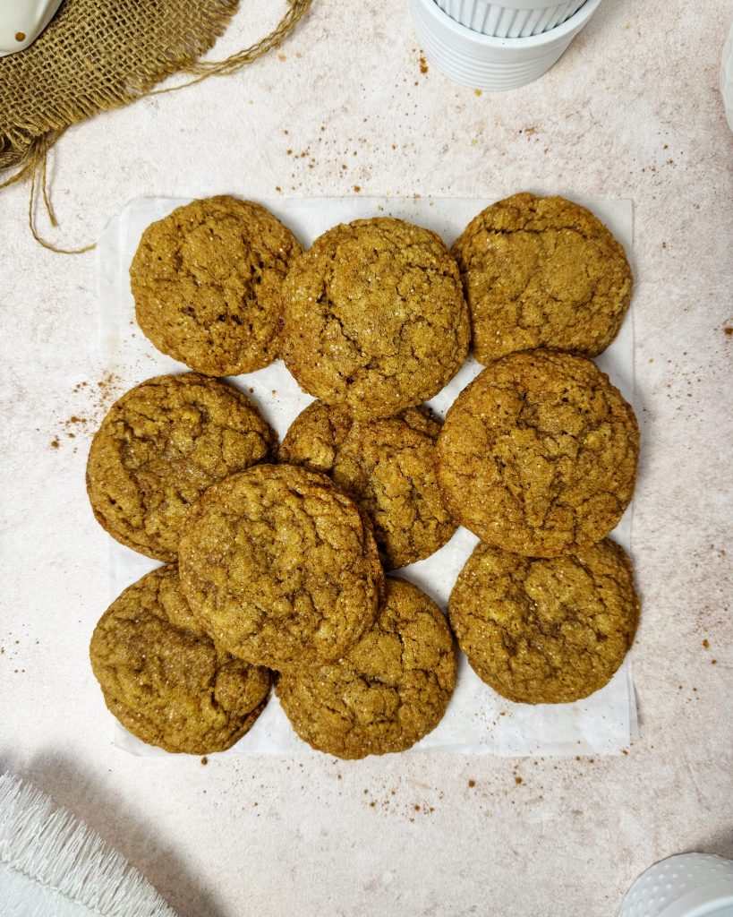 Vegan ginger molasses cookies placed on a parchment paper