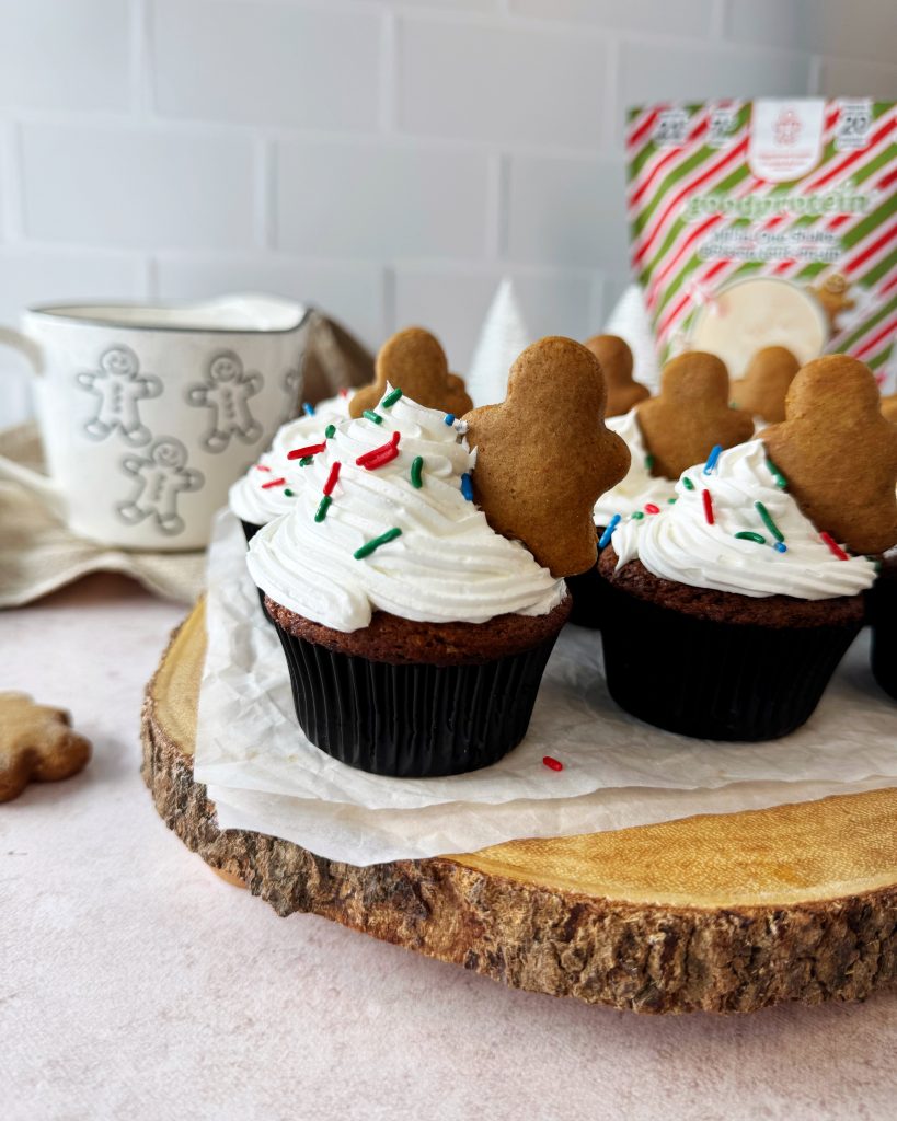 gingerbread muffins with frosting and mini gingerbread stuffed into frosting