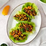 tempeh lettuce wraps topped with sliced bell peppers