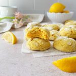 lemon crinkle cookies with bite taken out of one