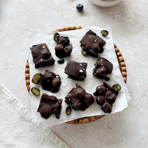chocolate covered blueberry chunks on parchment paper
