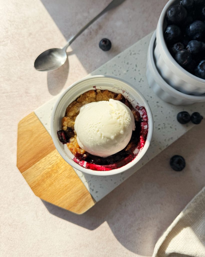 single serving blueberry crumble topped with ice cream