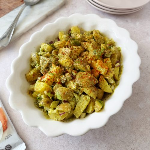 vegan potato salad in oval white bowl