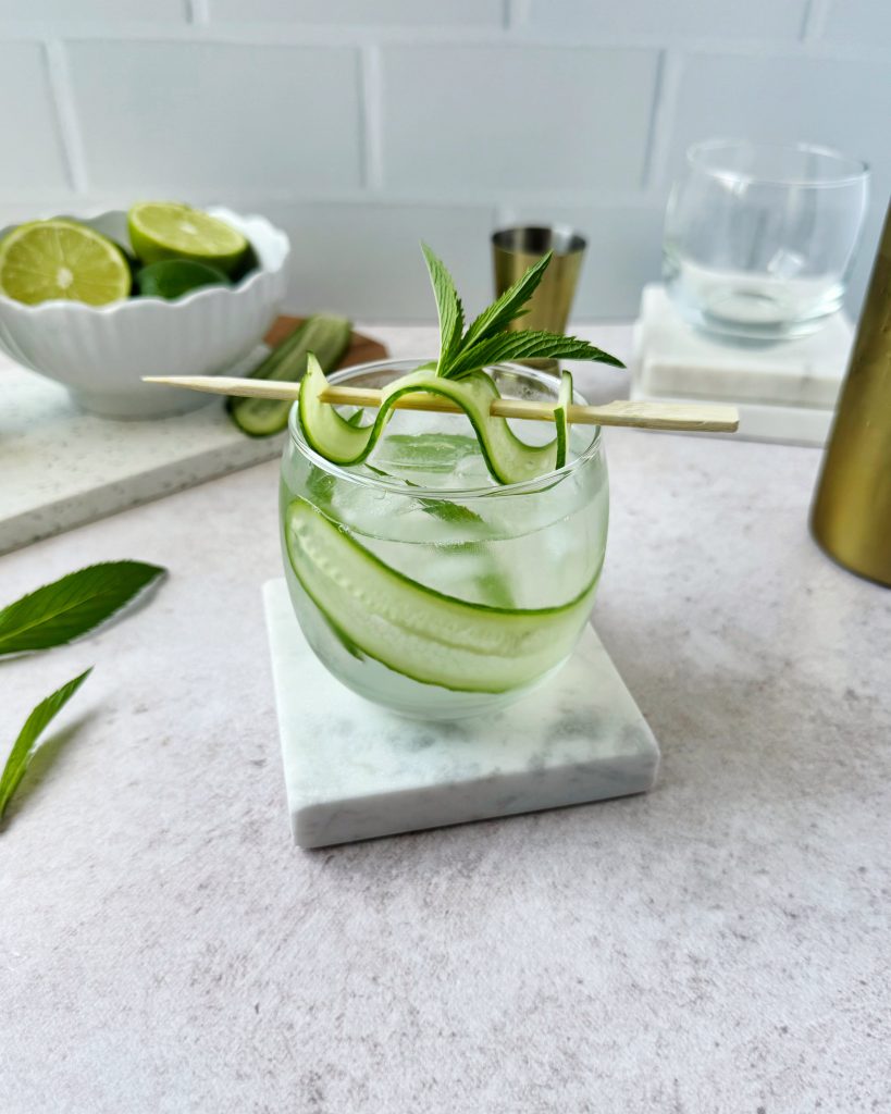 refreshing virgin mojito garnished with cucumber and mint