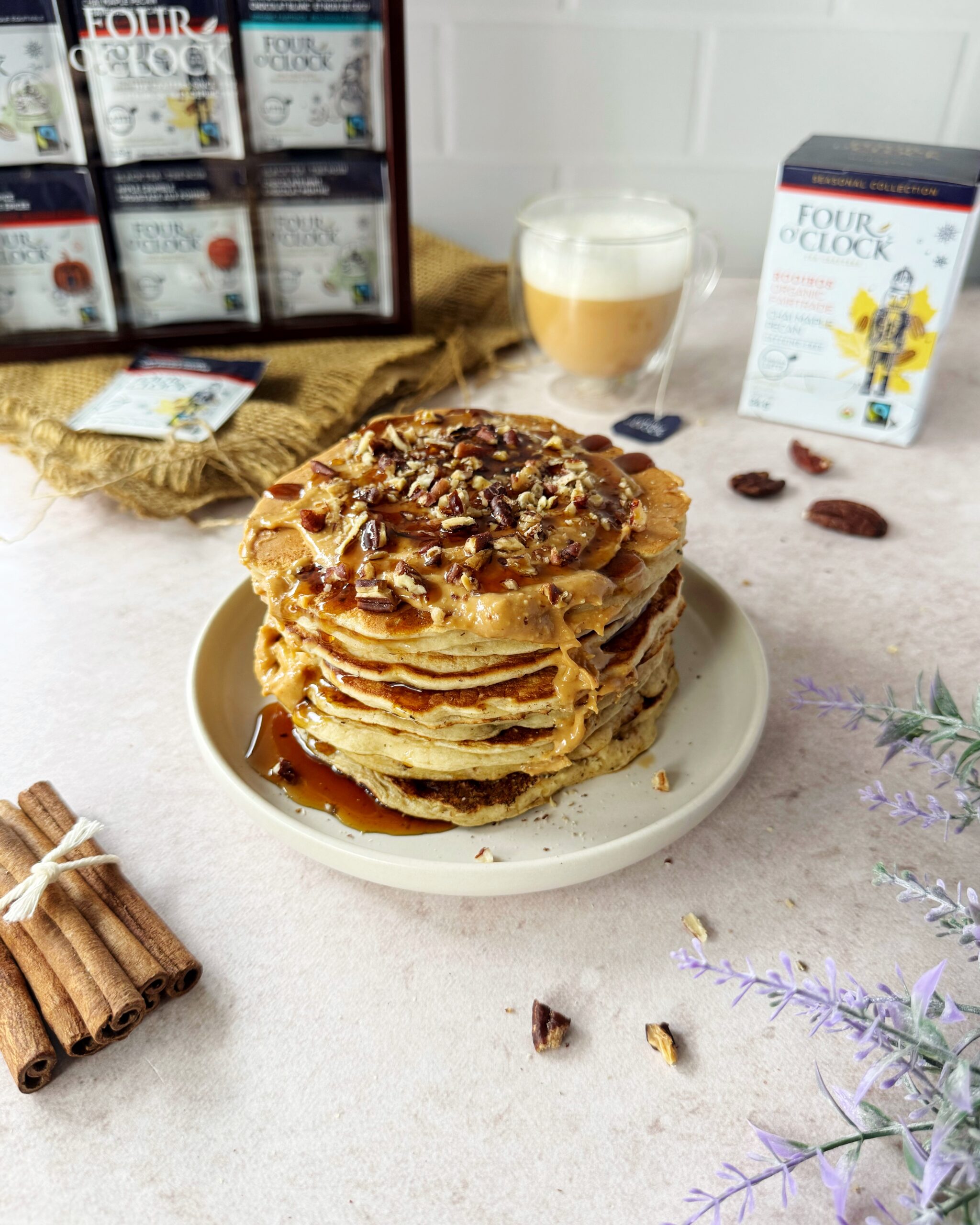 Chai maple pecan pancakes with crushed pecans peanut butter and maple syrup