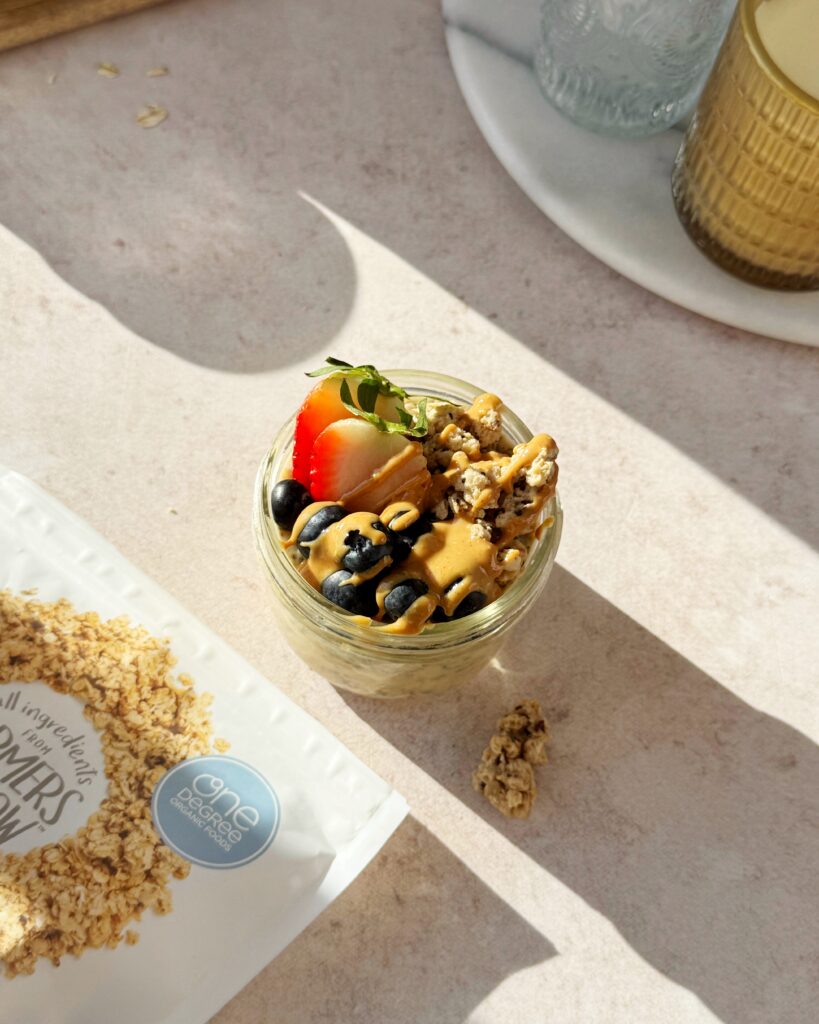 sprouted overnight oats topped with fruits and peanut butter 