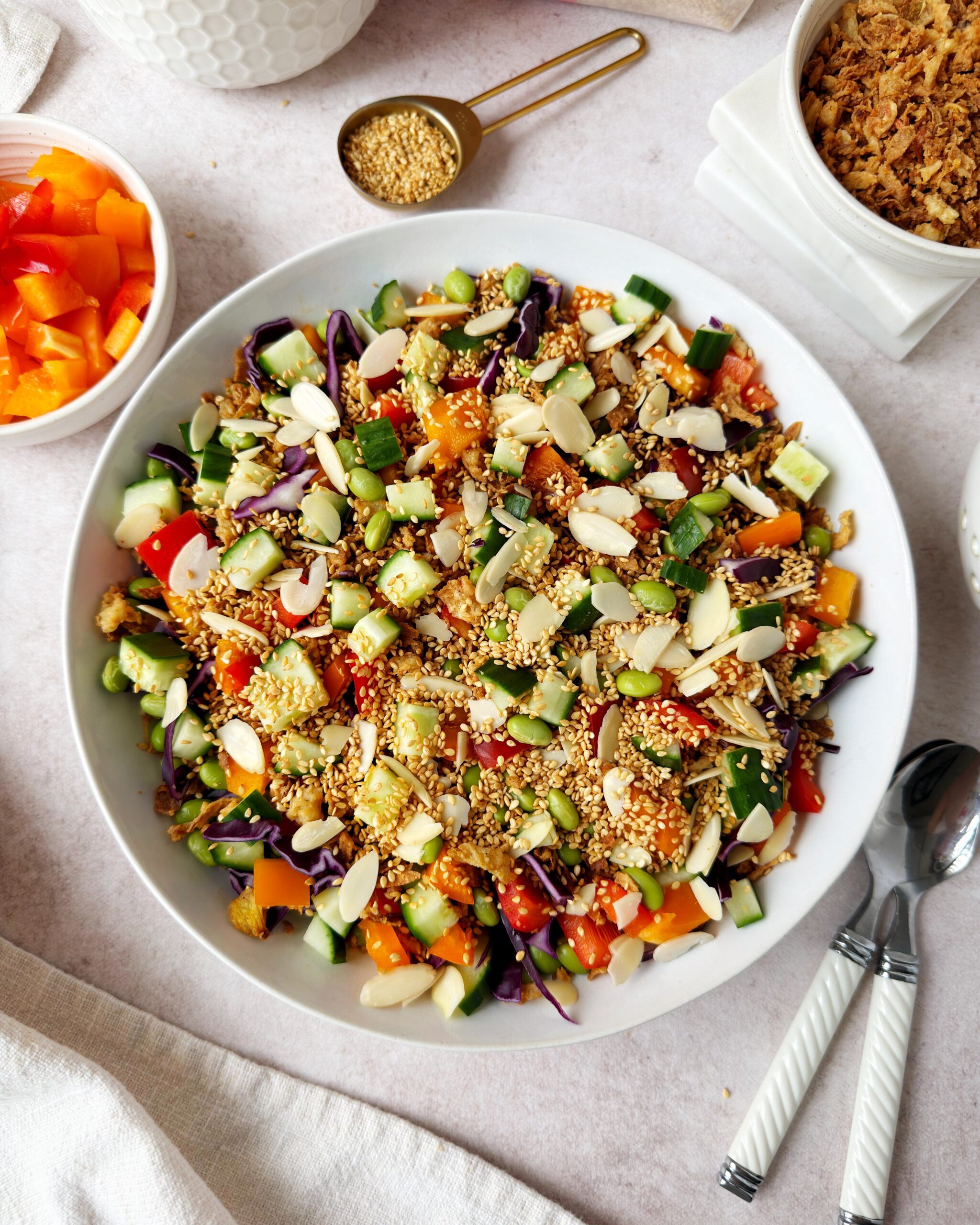 crunchy rainbow salad with red cabbage, almonds, crispy fried onions and sesame seeds